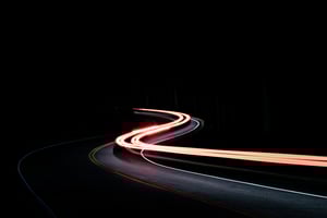Road at night with car light